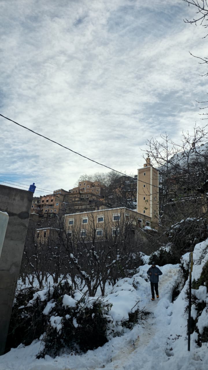 Riad Jnane Imlil pool and garden covered in snow in Imlil, Morocco