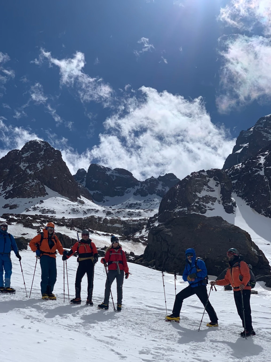 Trekkers on a rocky mountain trail in the Toubkal area of the High Atlas, Morocco