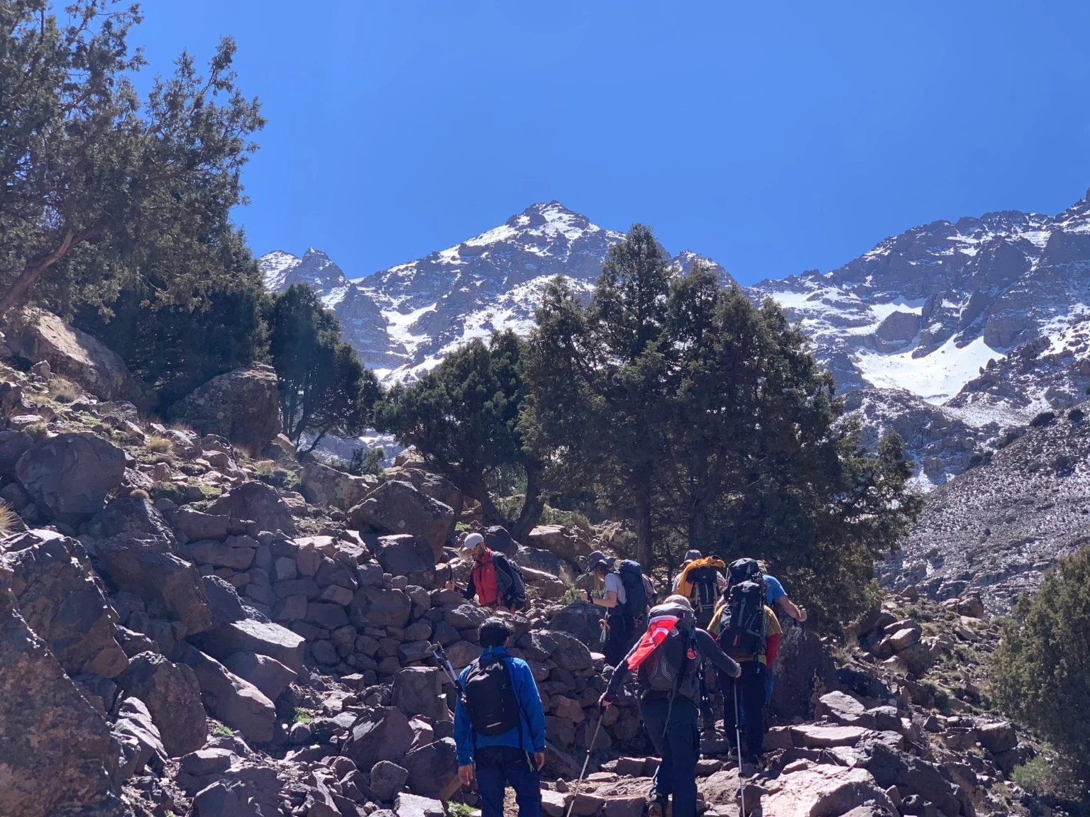Trekking group on a winter trail in the High Atlas near Toubkal, Morocco